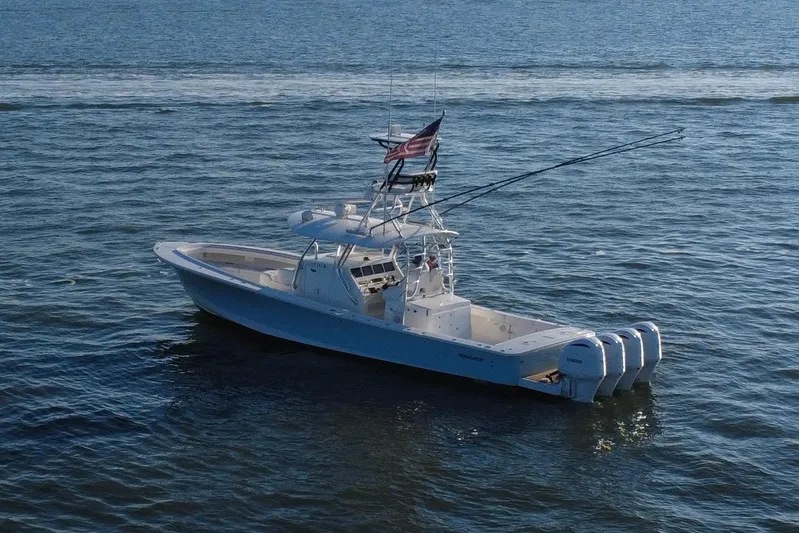  Yacht Photos Pics 2016 Regulator 41 boat on open water with multiple outboard engines.