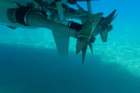 Underwater view of Seanfinity T5 2021 boat propellers in clear blue water.