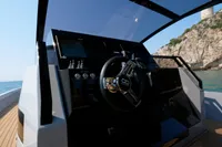 Helm of 2021 Seanfinity T5 boat with scenic coastal backdrop.