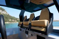 Interior of 2021 Seanfinity T5 boat with luxurious seating and scenic ocean view.