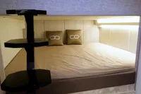 Luxurious cabin interior of 2021 Seanfinity T5 yacht with cozy bedding and modern design.