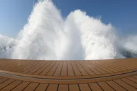 Seanfinity T5 2021 boat deck with powerful water spray against clear blue sky.
