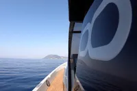 Seanfinity T5 boat cruising on calm sea with distant island view, 2021 model.