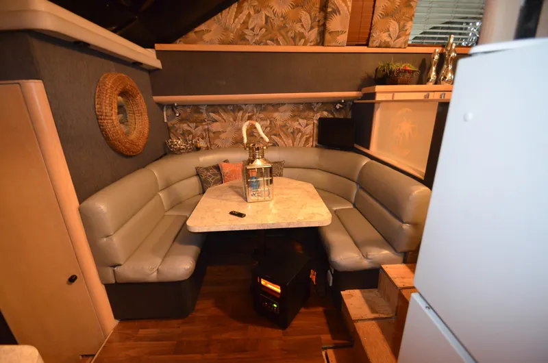 Suite Forty Six Yacht Photos Pics 1989 Silverton Aft Cabin 46 interior with cozy seating and decorative elements.