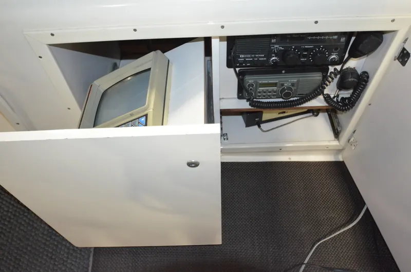 Suite Forty Six Yacht Photos Pics 1989 Silverton Aft Cabin 46 interior with vintage electronics and communication equipment.