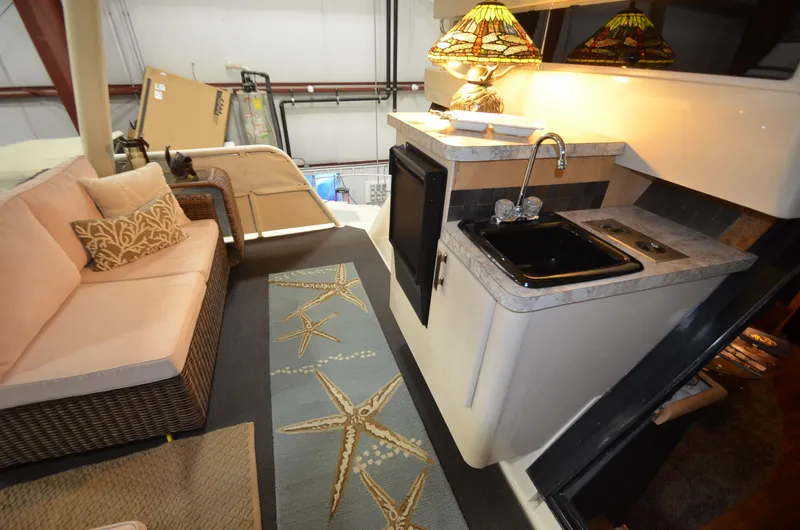 Suite Forty Six Yacht Photos Pics 1989 Silverton Aft Cabin 46 interior with kitchenette and seating area.