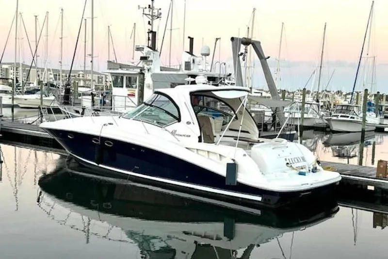  Yacht Photos Pics 2003 Sea Ray 420 Sundancer yacht docked at marina during sunset.