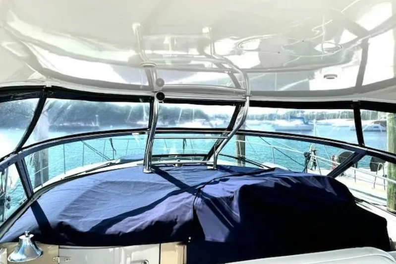  Yacht Photos Pics 2003 Sea Ray 420 Sundancer yacht interior with blue cover and ocean view.