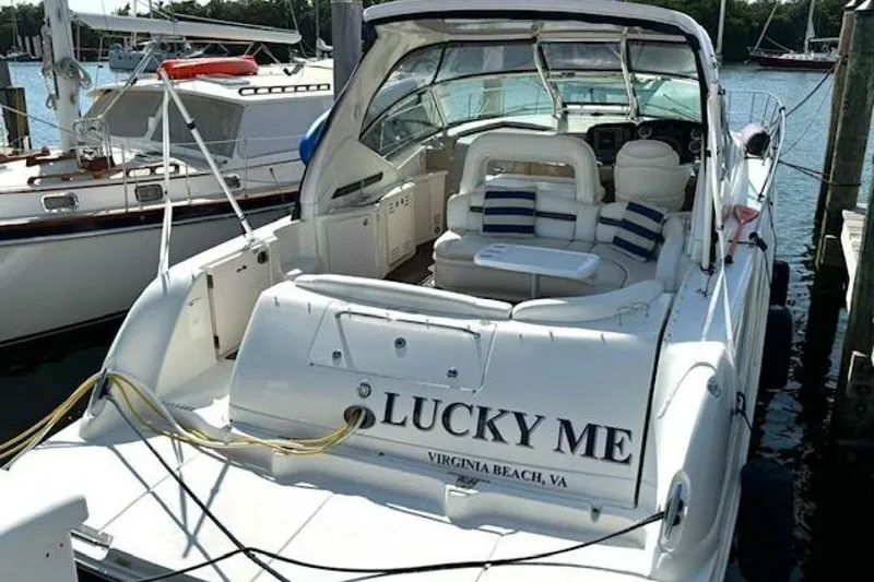  Yacht Photos Pics 2003 Sea Ray 420 Sundancer yacht docked, named "Lucky Me," with plush seating and nautical decor.