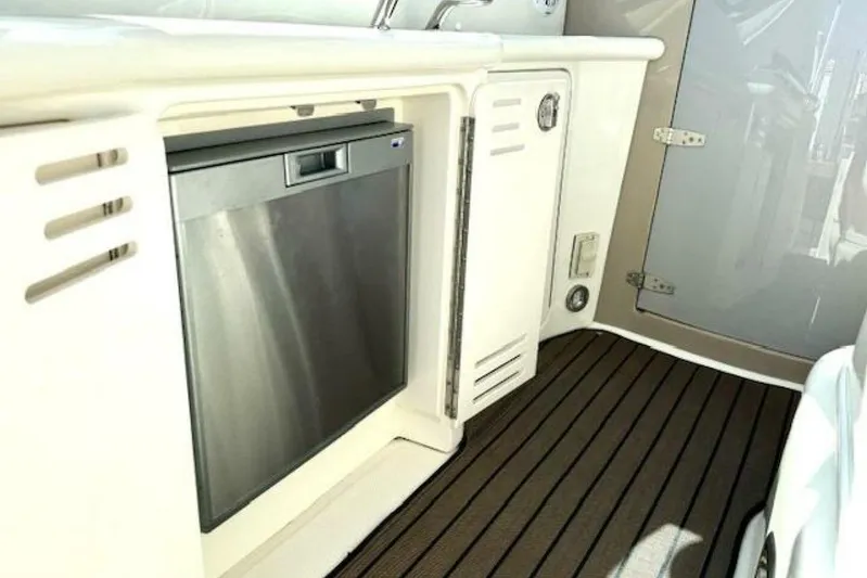  Yacht Photos Pics 2003 Sea Ray 420 Sundancer interior with stainless steel appliance and sleek cabinetry.