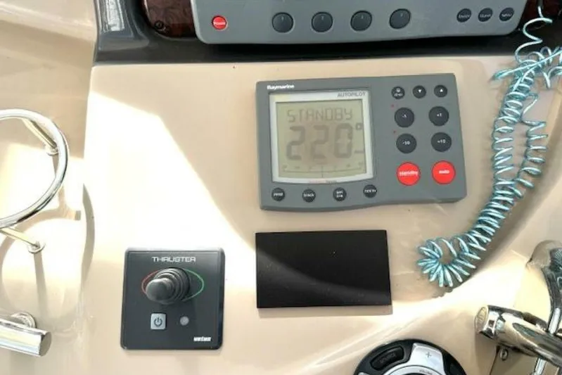  Yacht Photos Pics Control panel of 2003 Sea Ray 420 Sundancer with autopilot and thruster controls.