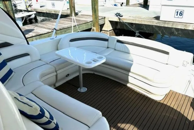  Yacht Photos Pics Luxurious seating area on 2003 Sea Ray 420 Sundancer yacht, featuring elegant white upholstery.