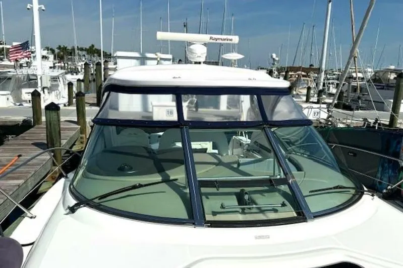  Yacht Photos Pics 2003 Sea Ray 420 Sundancer yacht docked at a marina with clear blue skies.