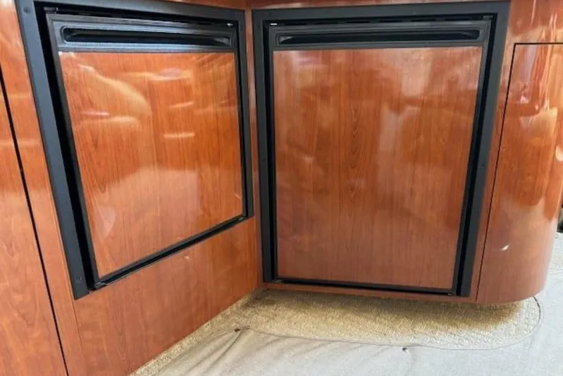  Yacht Photos Pics Wood-paneled refrigerator doors on a 2003 Sea Ray 420 Sundancer yacht.