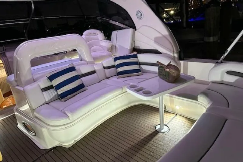  Yacht Photos Pics Luxurious interior of 2003 Sea Ray 420 Sundancer yacht with plush seating and table.