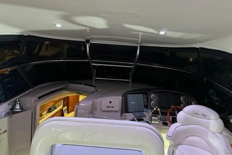  Yacht Photos Pics Interior view of 2003 Sea Ray 420 Sundancer yacht cockpit with helm and seating.