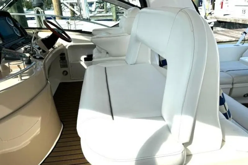  Yacht Photos Pics 2003 Sea Ray 420 Sundancer interior with white seating and helm station.