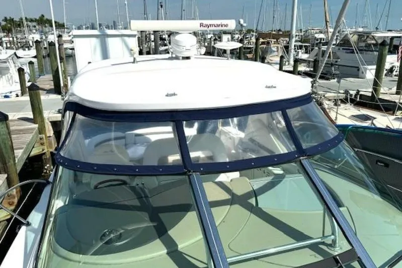  Yacht Photos Pics 2003 Sea Ray 420 Sundancer yacht docked at a marina, featuring a sleek design.