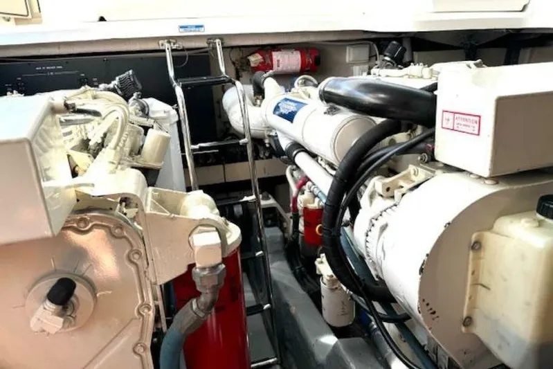  Yacht Photos Pics Engine room of a 2003 Sea Ray 420 Sundancer yacht, showcasing mechanical components.