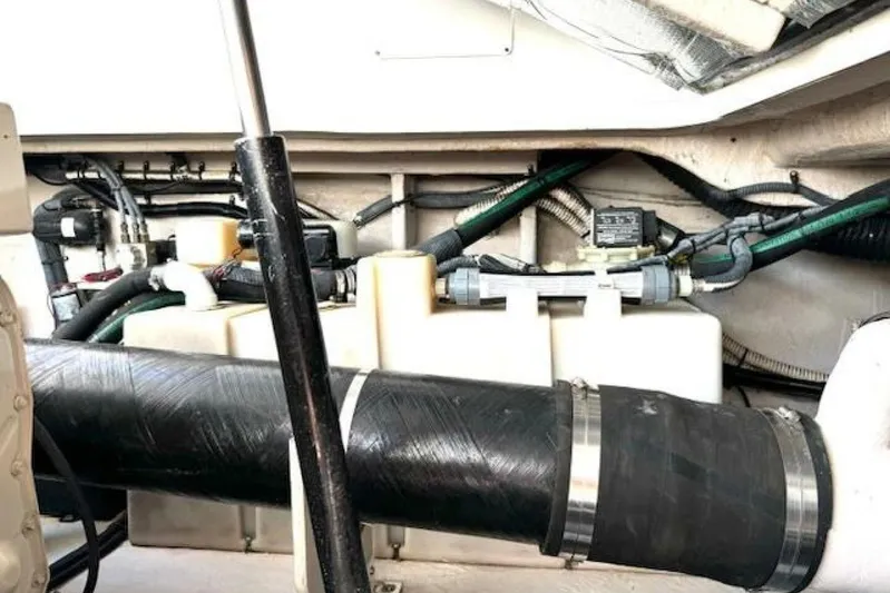  Yacht Photos Pics Engine compartment of 2003 Sea Ray 420 Sundancer with visible hoses and components.