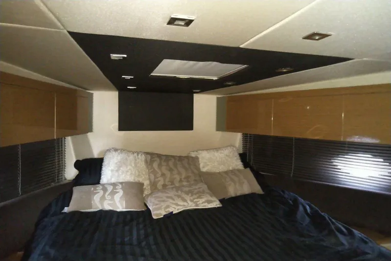 Sol Yacht Photos Pics Luxurious bedroom interior of 2010 Azimut Atlantis 54 yacht with plush bedding and modern design.