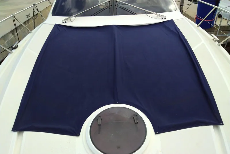 Sol Yacht Photos Pics 2010 Azimut Atlantis 54 yacht deck with blue cover and hatch.