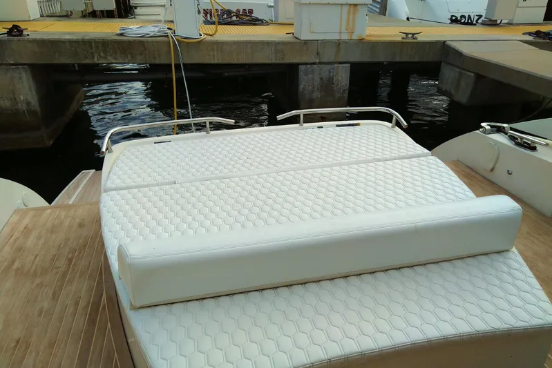 Sol Yacht Photos Pics Rear view of 2010 Azimut Atlantis 54 yacht with white cushioned seating.