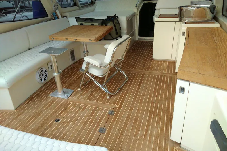 Sol Yacht Photos Pics Luxurious interior of 2010 Azimut Atlantis 54 yacht with wooden flooring and seating area.