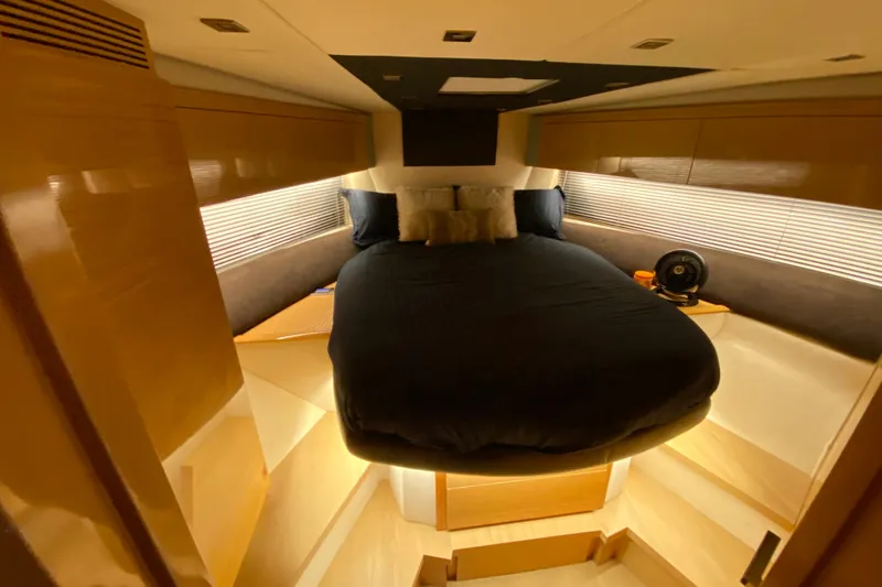 Sol Yacht Photos Pics Luxurious cabin interior of 2010 Azimut Atlantis 54 yacht with cozy bed and ambient lighting.