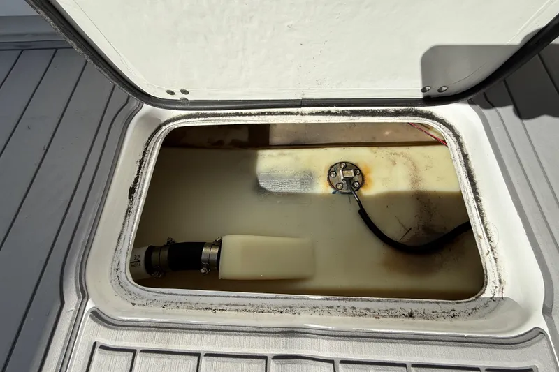  Yacht Photos Pics Open hatch of 2023 Cape Horn 32 XS boat showing internal compartment and components.