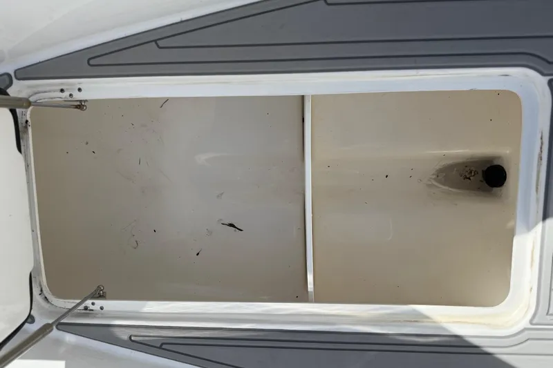  Yacht Photos Pics Open storage compartment on 2023 Cape Horn 32 XS boat, showing interior details.