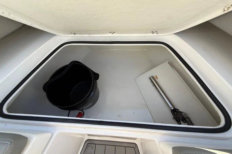  Yacht Photos Pics Storage compartment of 2023 Cape Horn 32 XS boat with bucket and tools.