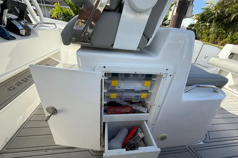  Yacht Photos Pics 2023 Cape Horn 32 XS boat interior with open storage compartment and seating.