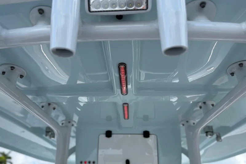  Yacht Photos Pics 2023 Cape Horn 32 XS boat interior ceiling with mounted lights and rod holders.