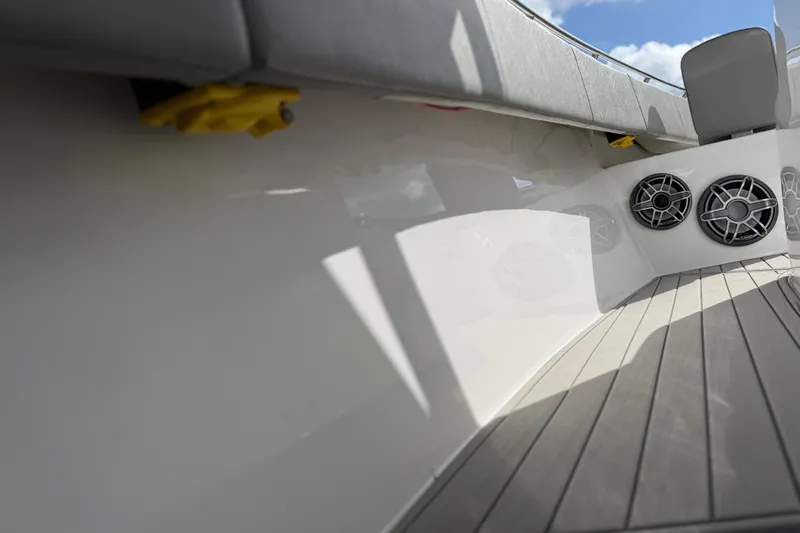  Yacht Photos Pics 2023 Cape Horn 32 XS boat interior with speakers and cushioned seating.