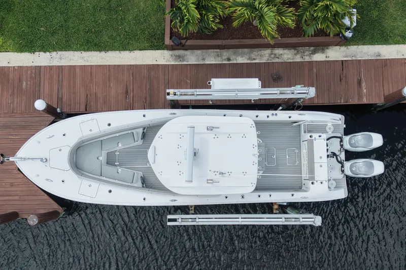  Yacht Photos Pics Top view of a 2023 Cape Horn 32 XS boat docked by wooden pier.