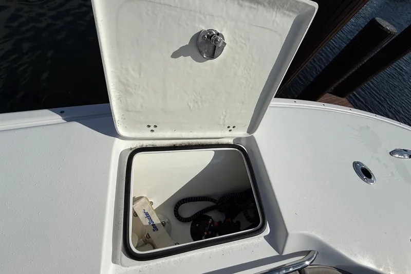  Yacht Photos Pics 2023 Cape Horn 32 XS boat compartment with open hatch, showing interior details.