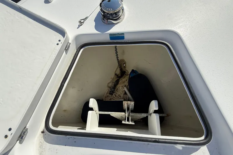  Yacht Photos Pics Open anchor compartment on 2023 Cape Horn 32 XS boat deck.