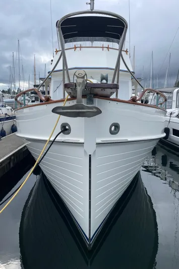  Yacht Photos Pics 1980 Grand Banks 42 Europa yacht docked at marina, front view.