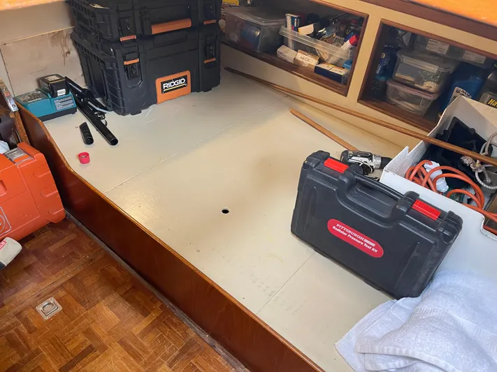  Yacht Photos Pics Interior workspace of 1980 Grand Banks 42 Europa with toolboxes and storage.