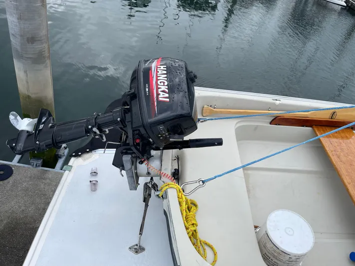  Yacht Photos Pics Outboard motor on a 1980 Grand Banks 42 Europa boat docked at a marina.