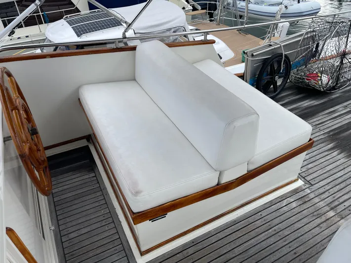  Yacht Photos Pics White cushioned seating on 1980 Grand Banks 42 Europa yacht deck.