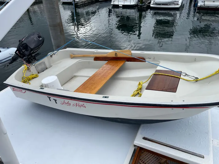  Yacht Photos Pics Small boat on Grand Banks 42 Europa, 1980 model, docked at marina.