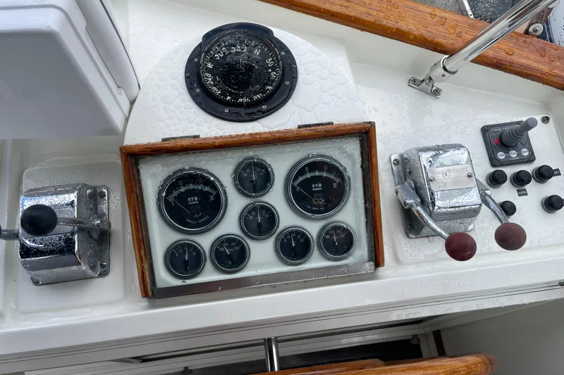  Yacht Photos Pics Control panel of a 1980 Grand Banks 42 Europa boat with gauges and levers.