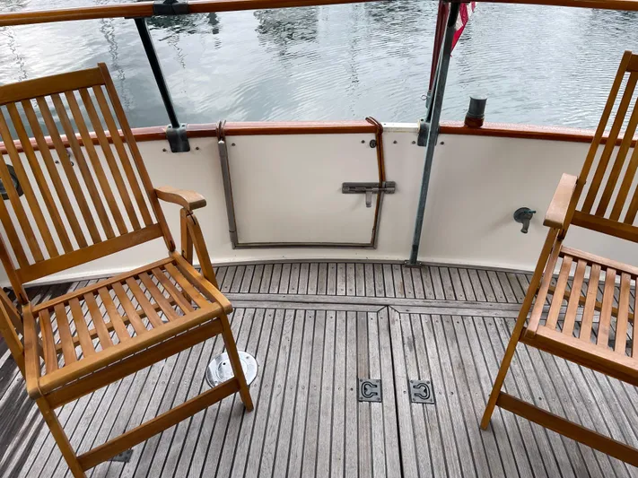  Yacht Photos Pics Teak deck with wooden chairs on a 1980 Grand Banks 42 Europa yacht.