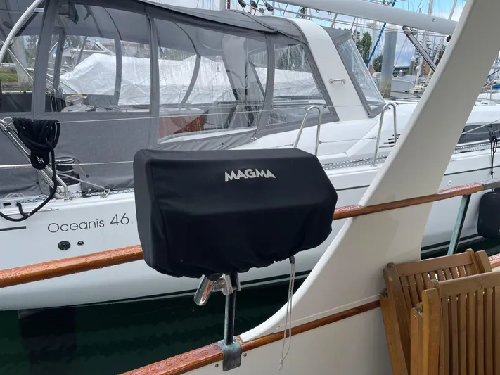  Yacht Photos Pics Magma grill on 1980 Grand Banks 42 Europa yacht, docked near Oceanis 46.1 sailboat.