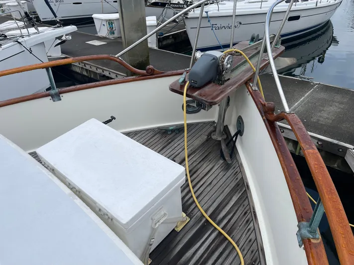  Yacht Photos Pics 1980 Grand Banks 42 Europa boat deck with wooden railings and equipment.