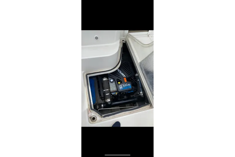  Yacht Photos Pics Engine compartment of 2003 Regal Commodore 3880 boat, featuring a Mercury engine.