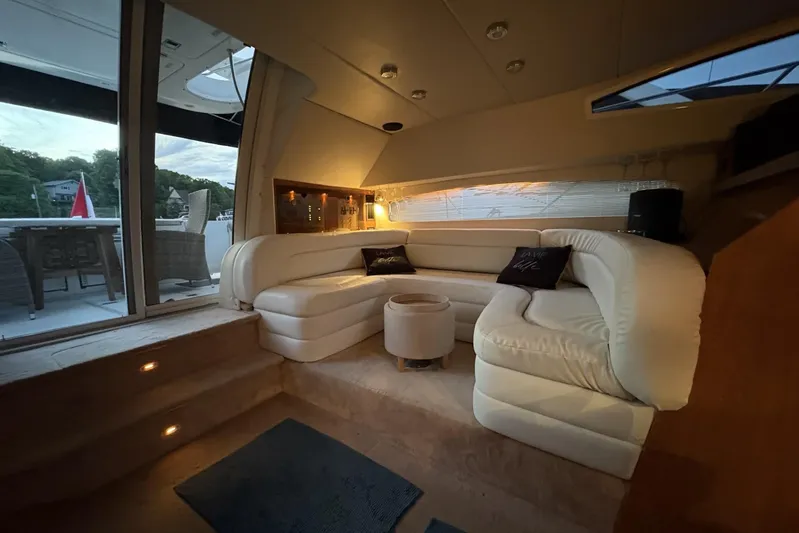  Yacht Photos Pics Luxurious interior of 2003 Regal Commodore 3880 yacht with plush seating and ambient lighting.