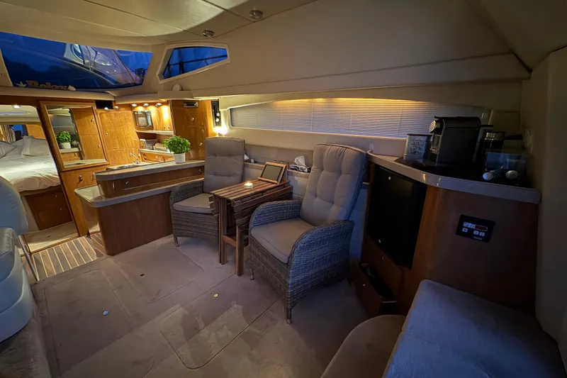  Yacht Photos Pics Luxurious interior of 2003 Regal Commodore 3880 yacht with cozy seating and modern amenities.